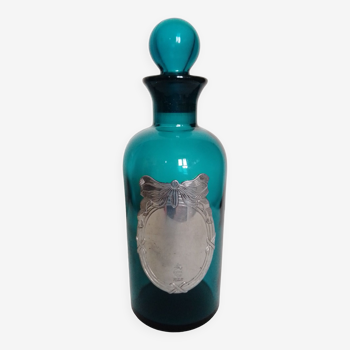 Glass bottle and turquoise blue cap