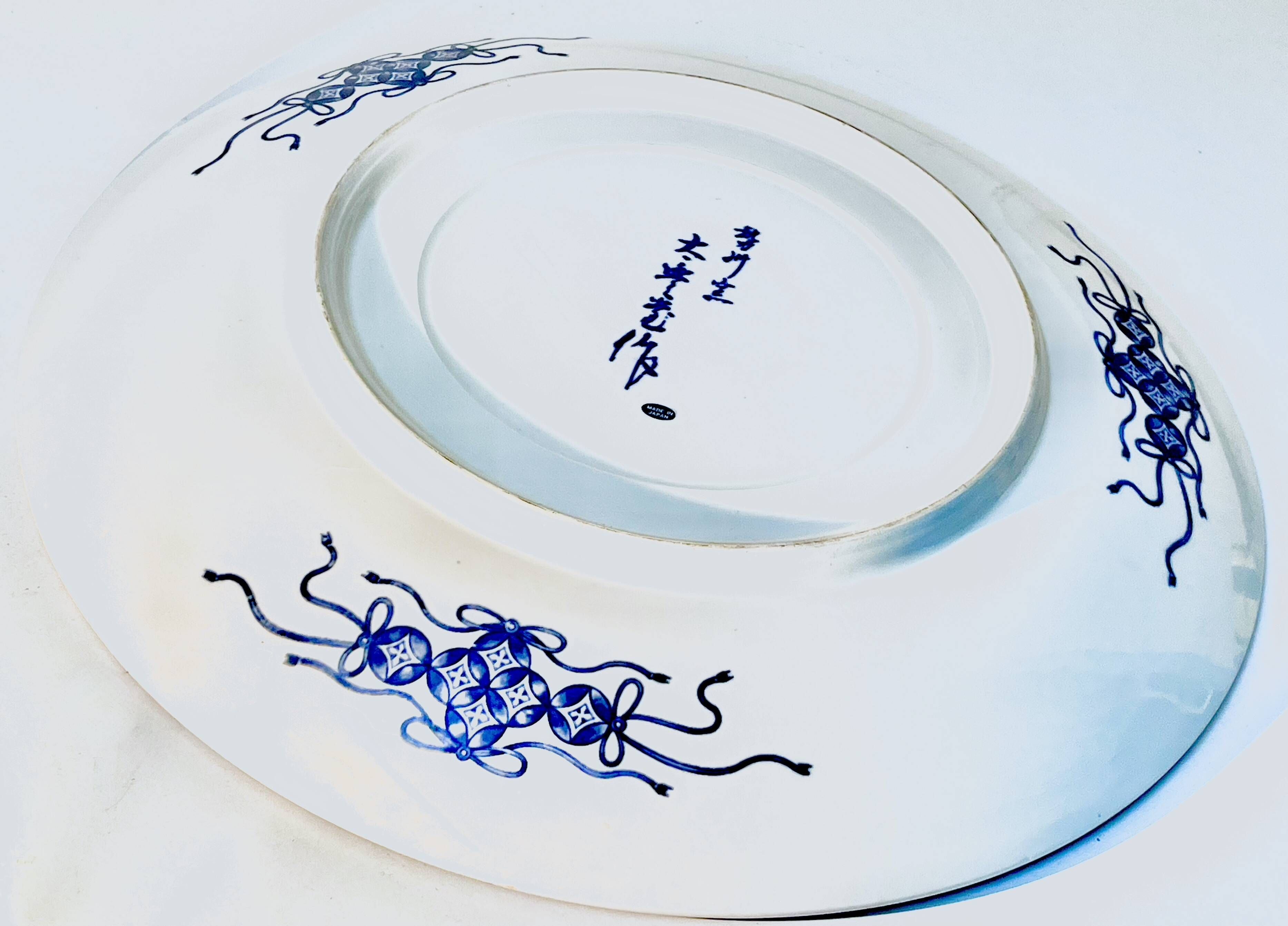 Decorative porcelain plate featuring a koi carp.