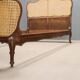 Simple bed in Barocchetto style in walnut.