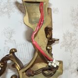 Pair of French baroque brass wall sconces with two branches, decorated with acanthus and wickerwork.