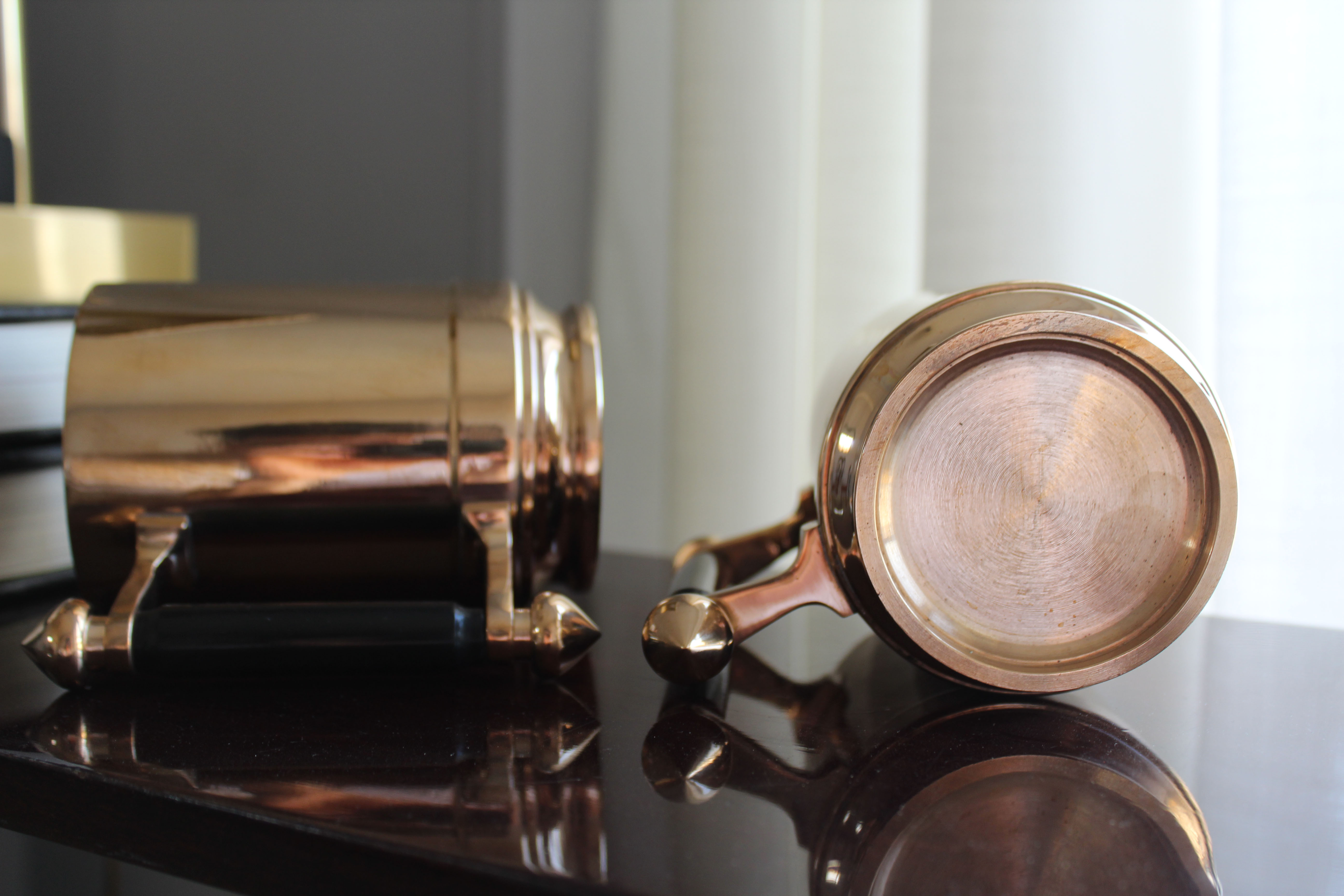 Pair of art deco bronze beer mugs France, 1940s, signed Bronze Star
