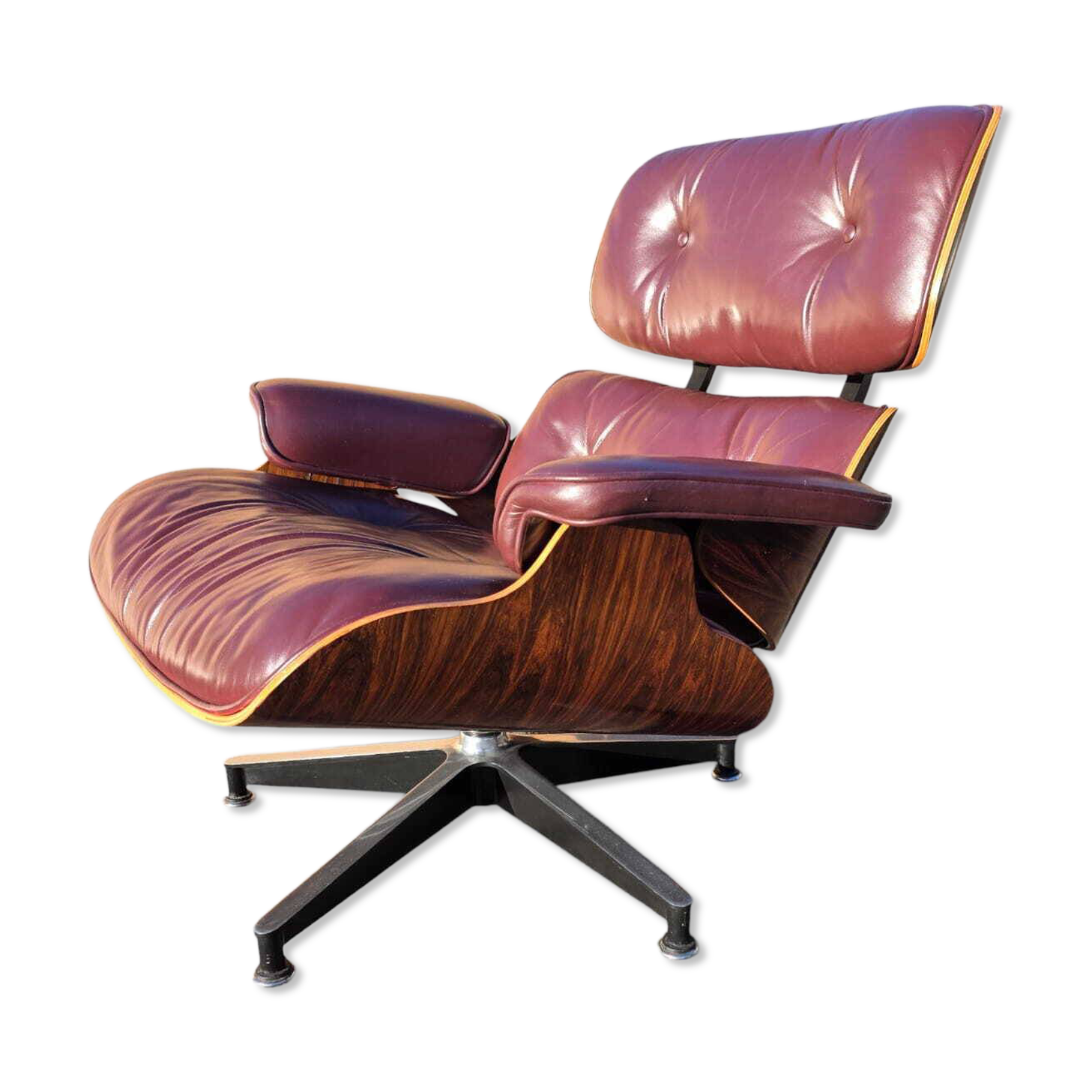 Original Eames lounge chair by Herman Miller in burgundy rosewood.