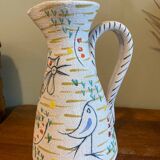 Pitcher with naive bird decor