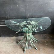 Vintage console in patinated metal with reed leaves.
