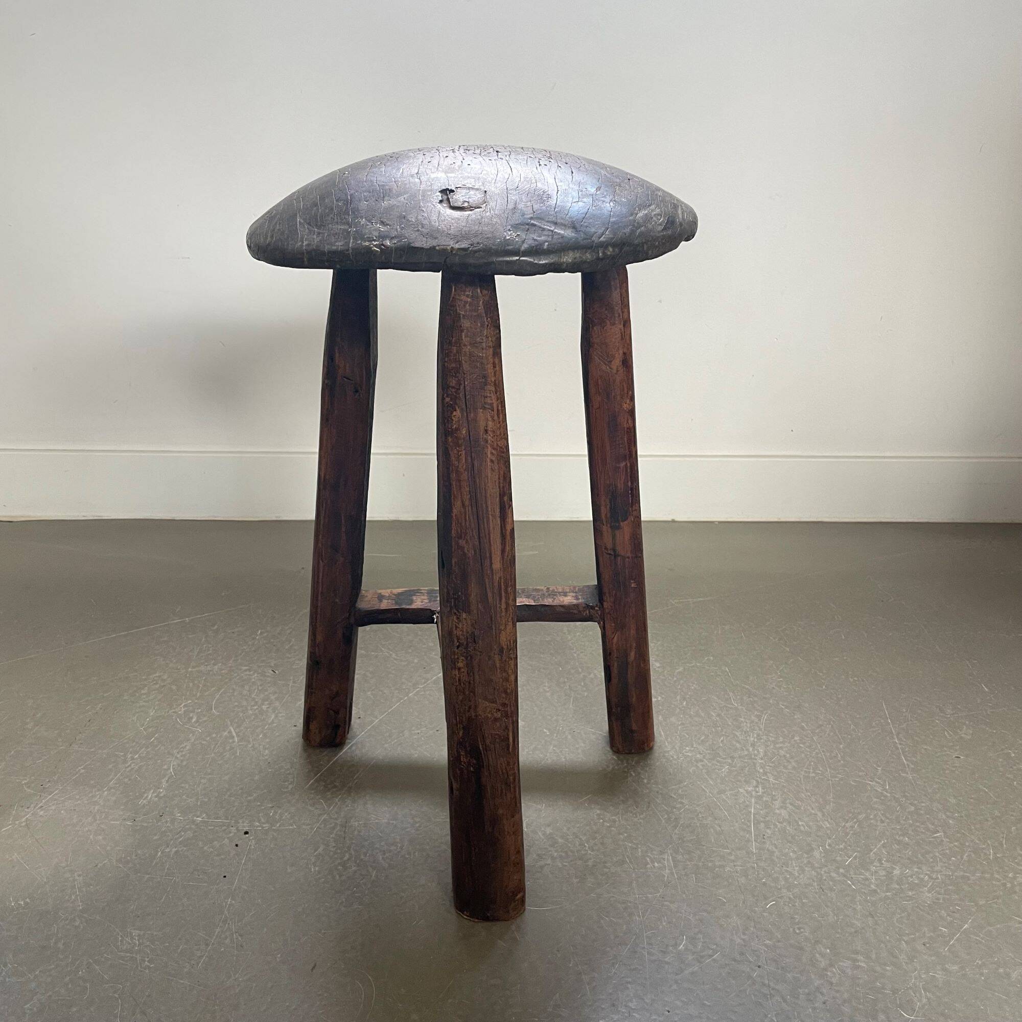 Antique tripod wooden stool, brutalist, wabi sabi style