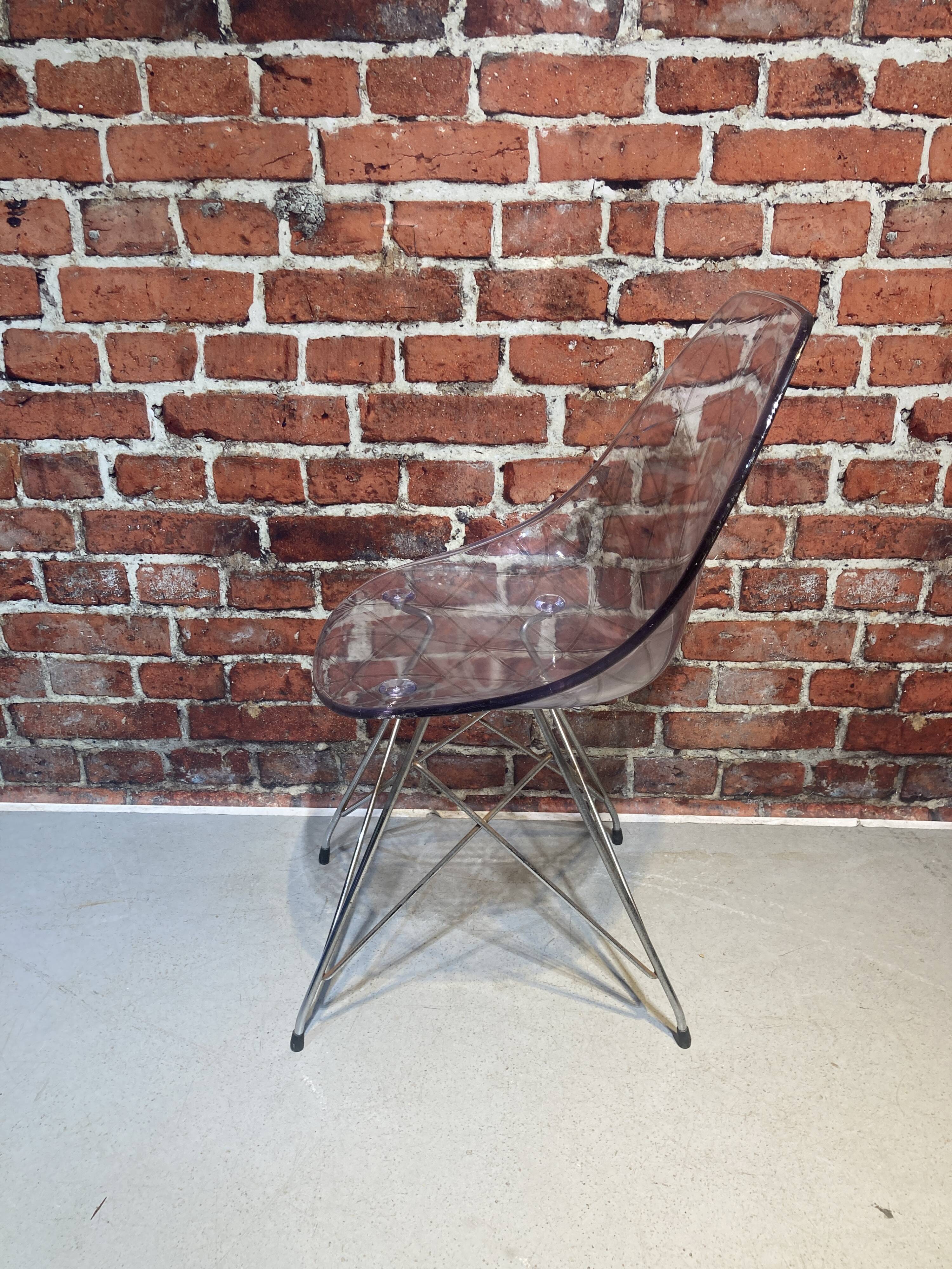 Set of four plexiglass and metal chairs