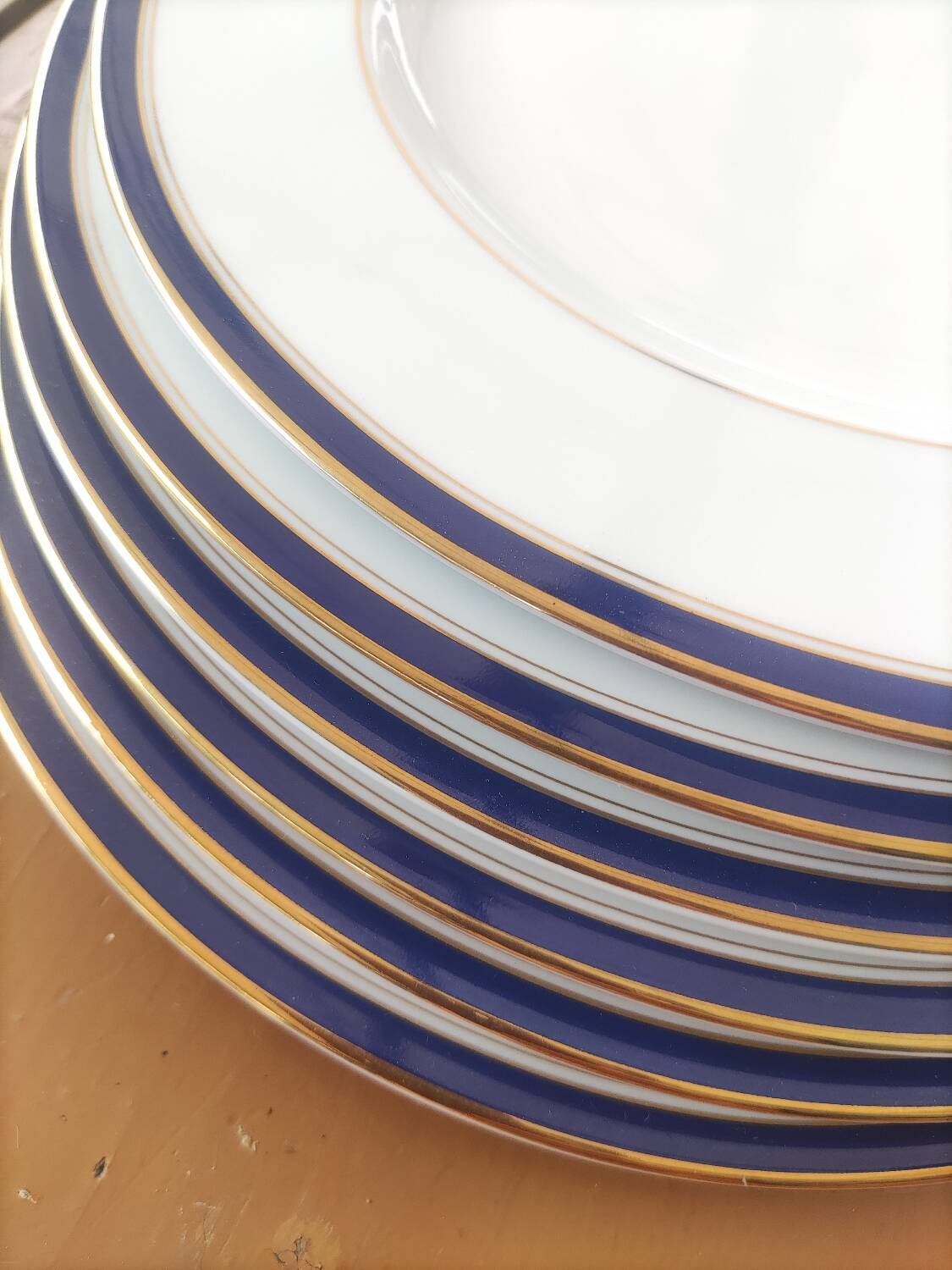 Six blue and gold Limoges porcelain dinner plates