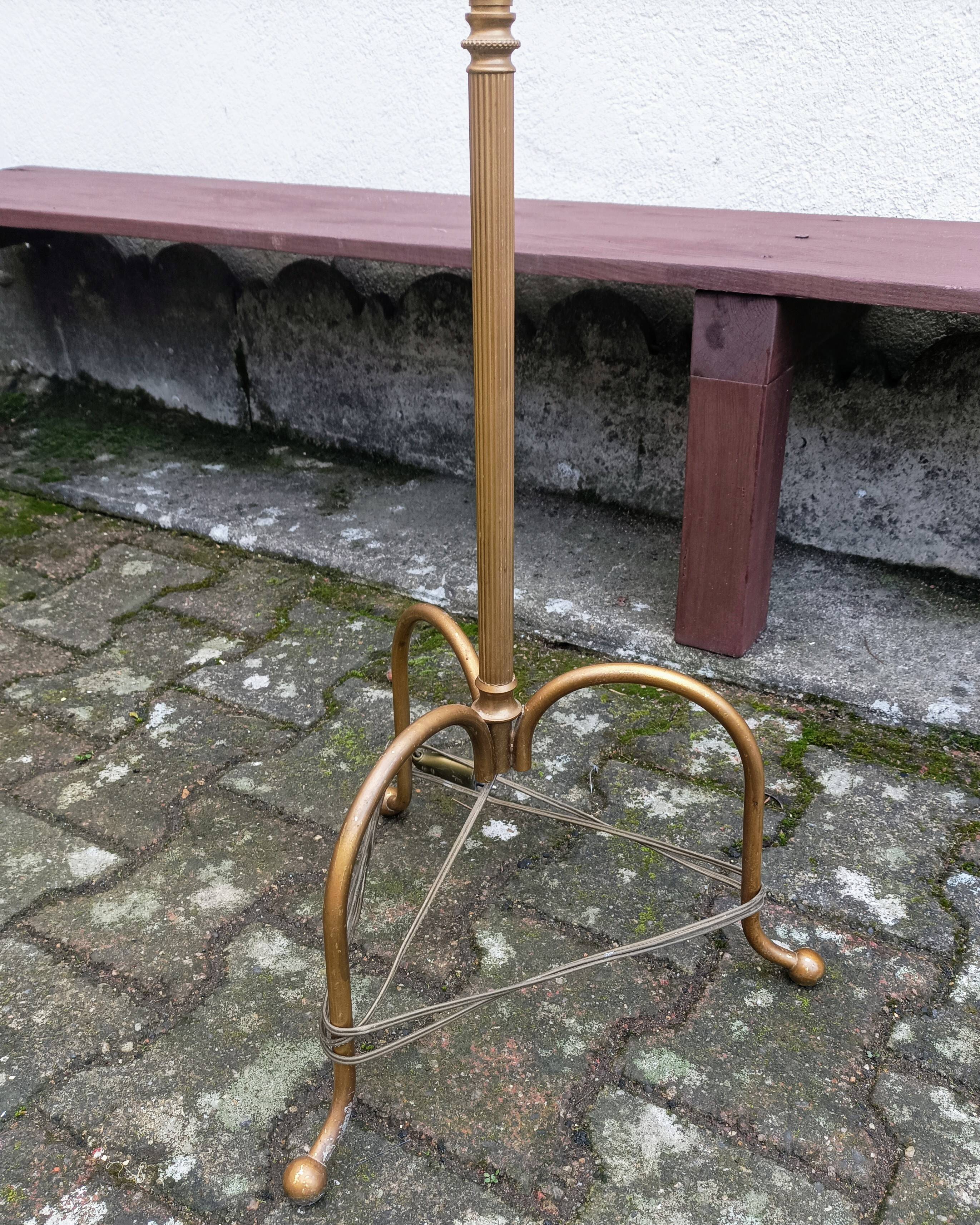 Brass tripod floor lamp