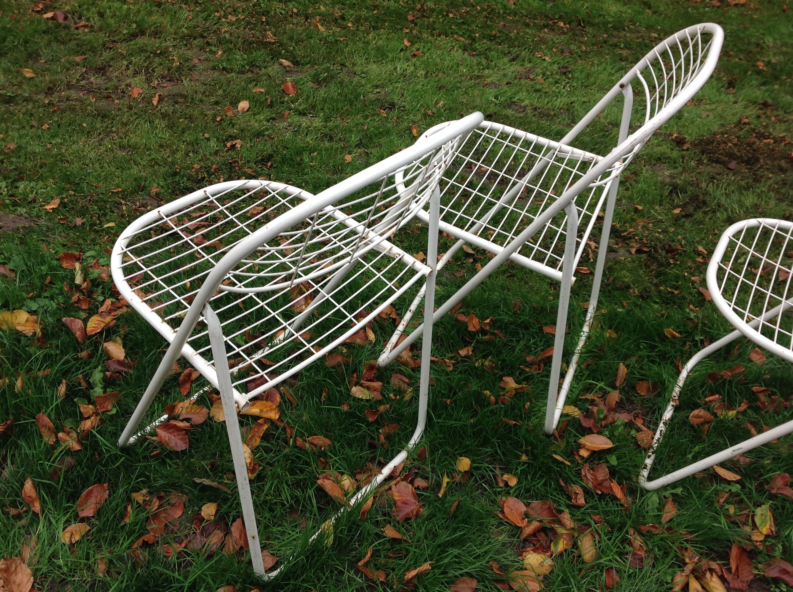 Trio of folding metal chairs