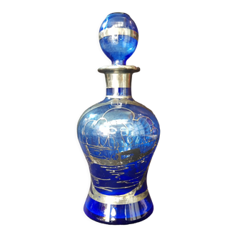 Cobalt blue bottle with silver patterns