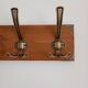 Wall-mounted coat rack with 5 vintage-style hooks in patinated wood and metal.