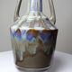 Vintage stoneware bottle with flamed glaze, France 1950-1970.