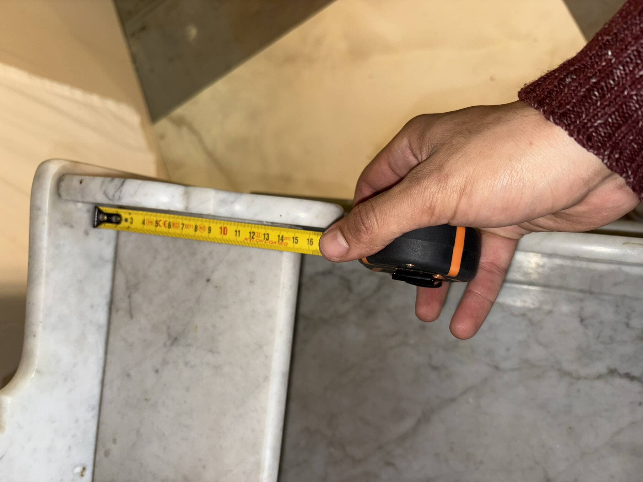 Antique wood and marble kitchen sideboard with carved backsplash