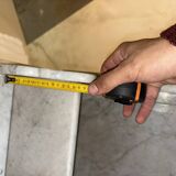 Antique wood and marble kitchen sideboard with carved backsplash