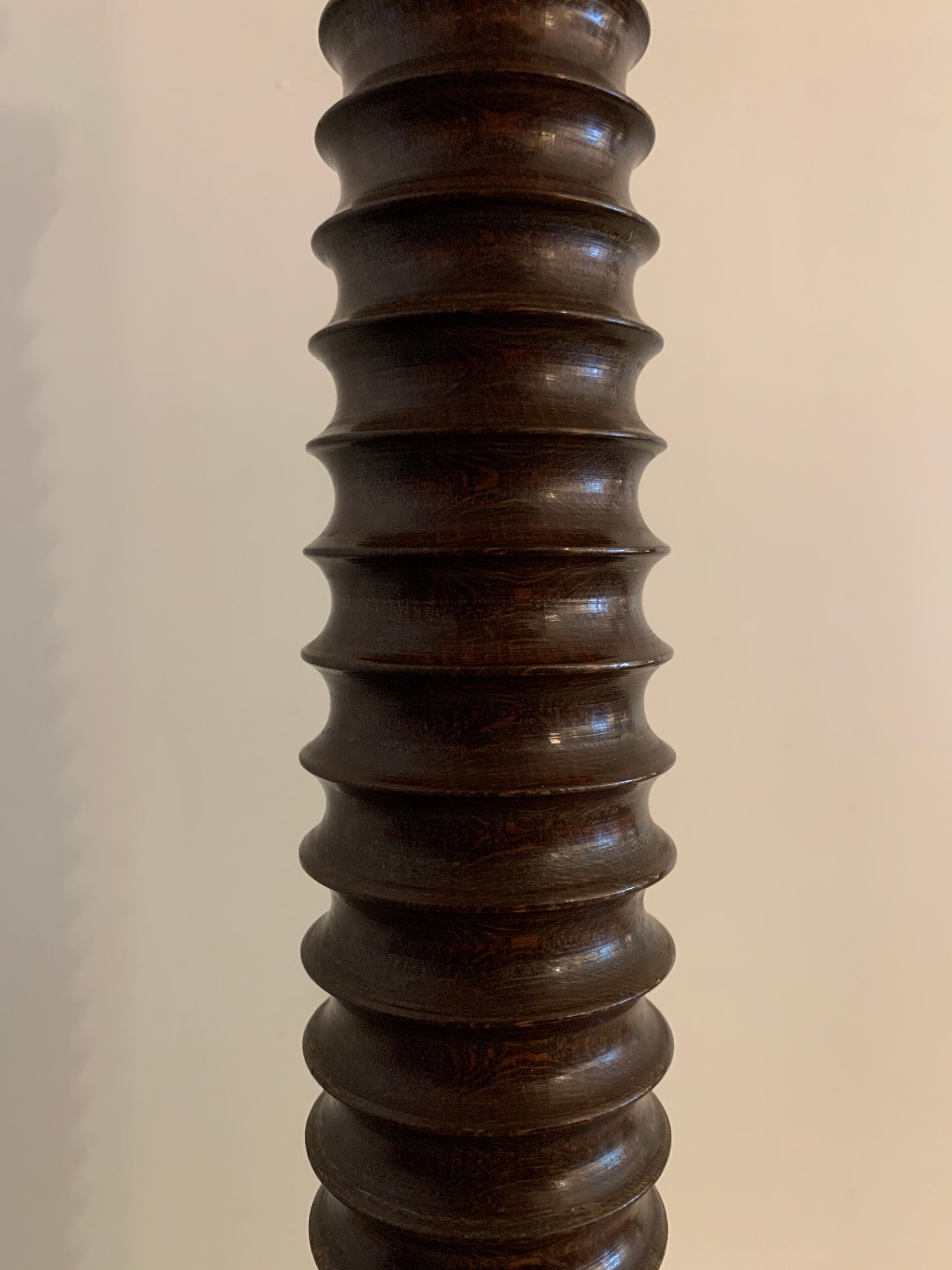 Turned wooden lamp foot in the shape of a warhead