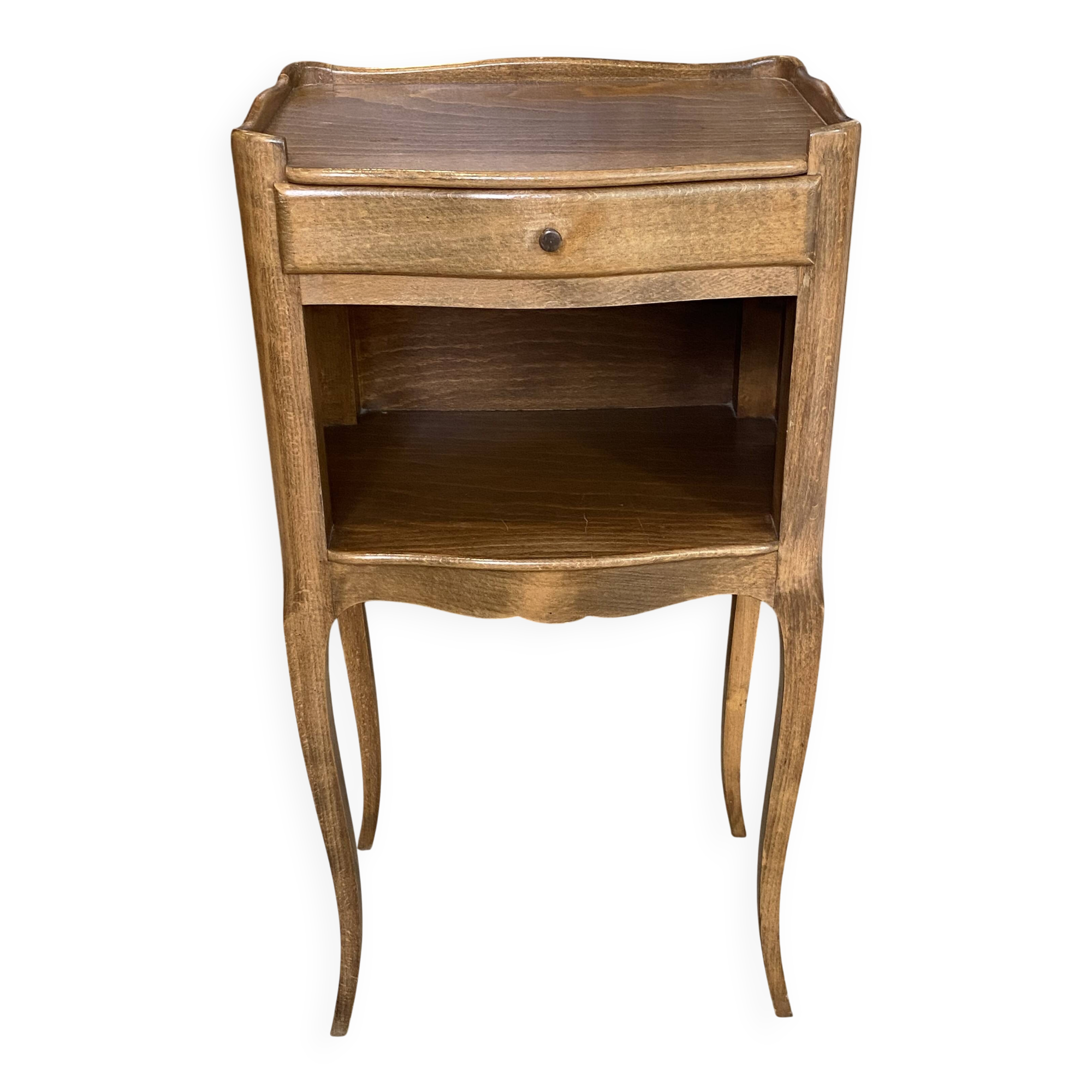 A bedside table with a drawer and a niche in Louis XV style.