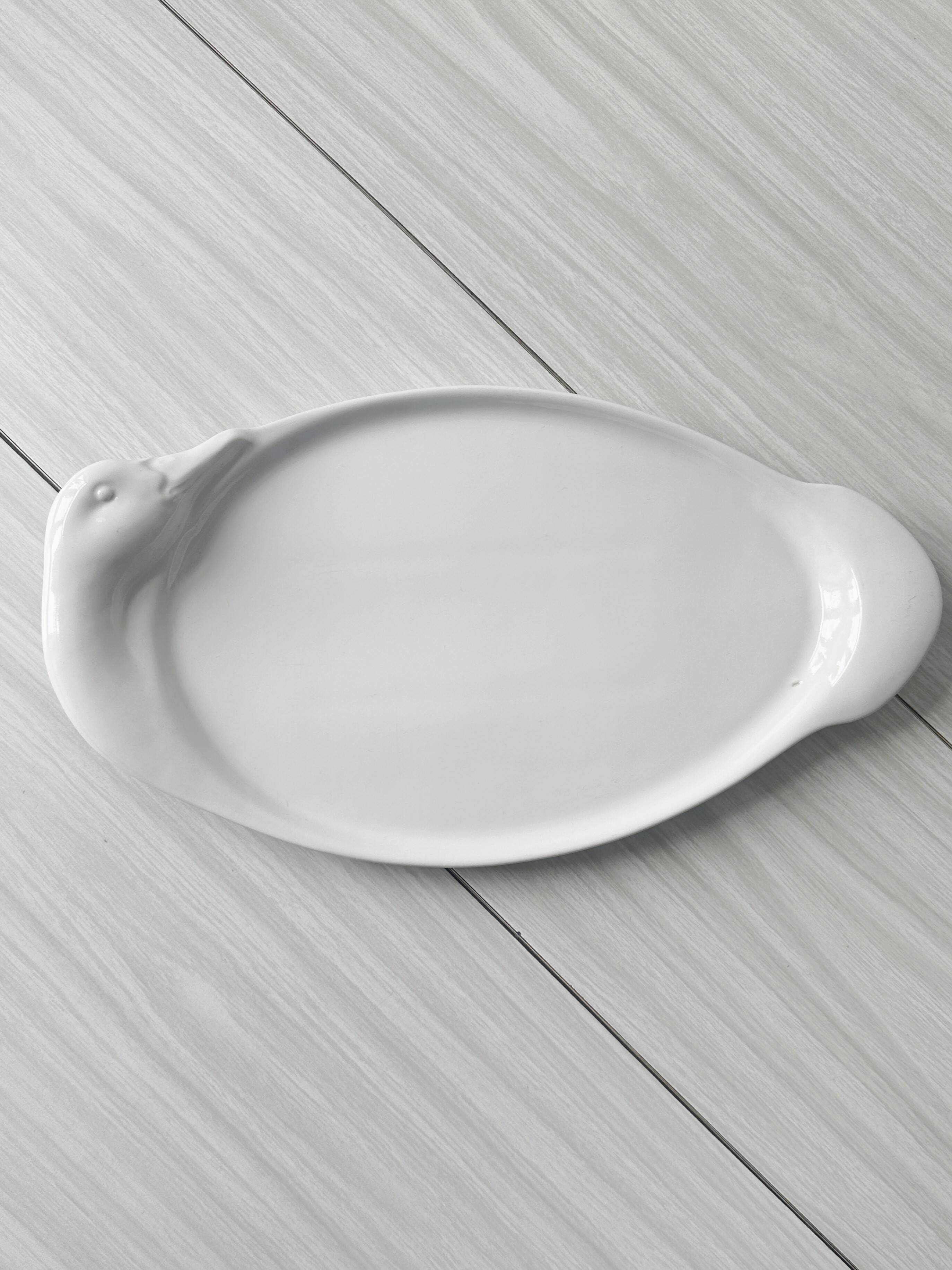 Porcelain goose serving dish.