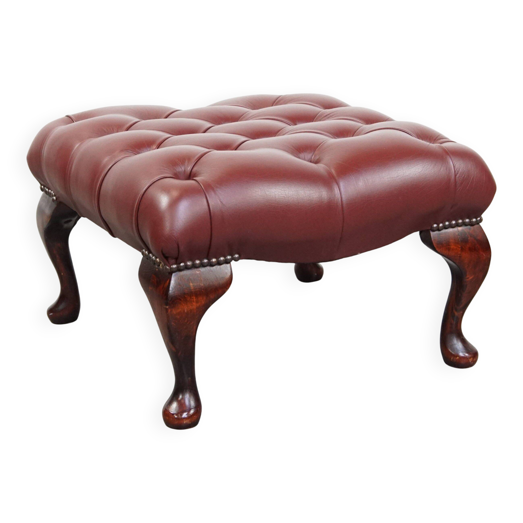 In very good condition elegant red/brown chesterfield ottoman made of cow leather