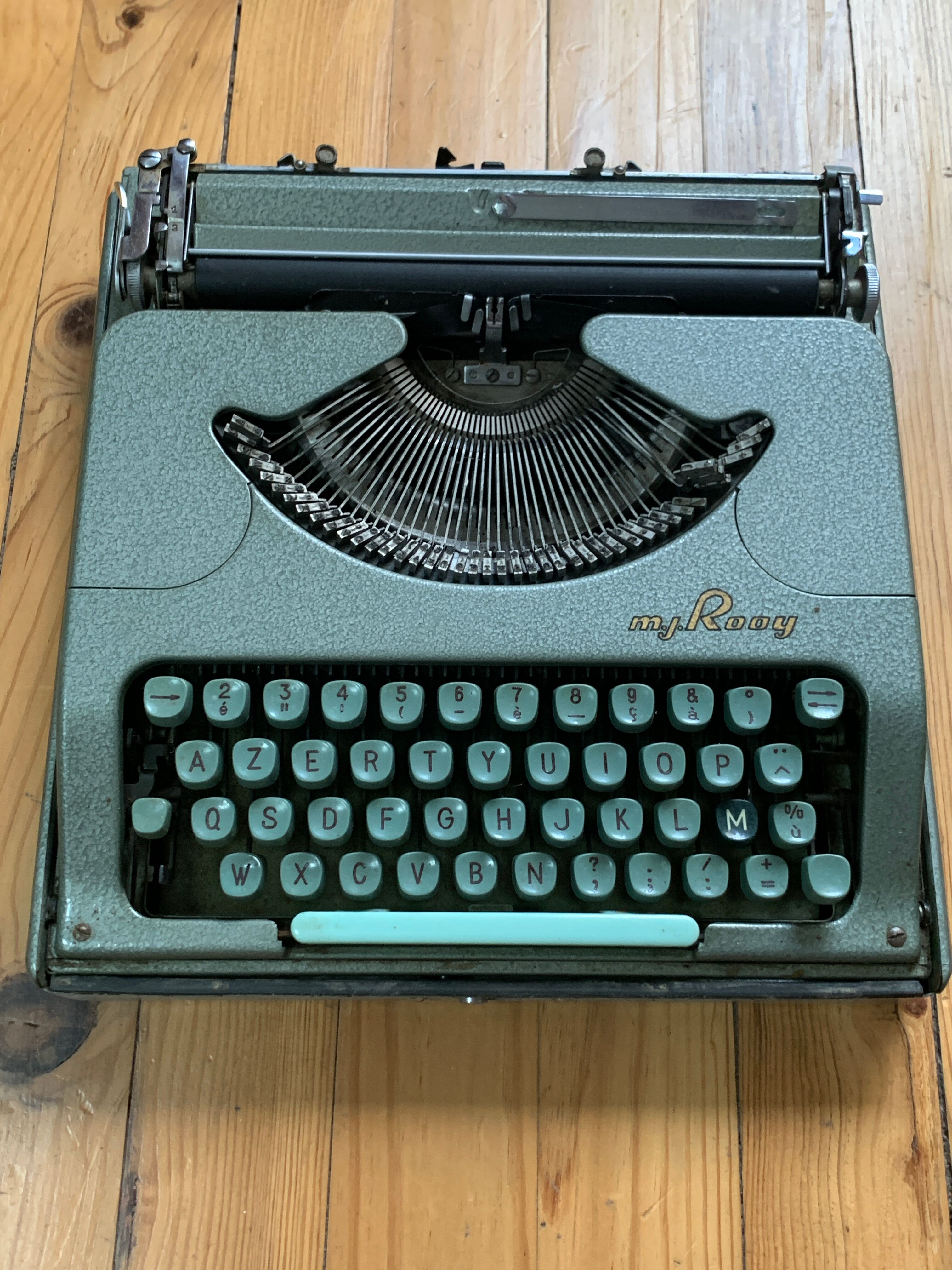 M.J. Rooy light green typewriter