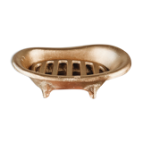 Cast iron soap dish in the shape of a bathtub