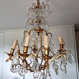 Lustre ancien à 8 bras de lumière à pampilles en bronze et cristal