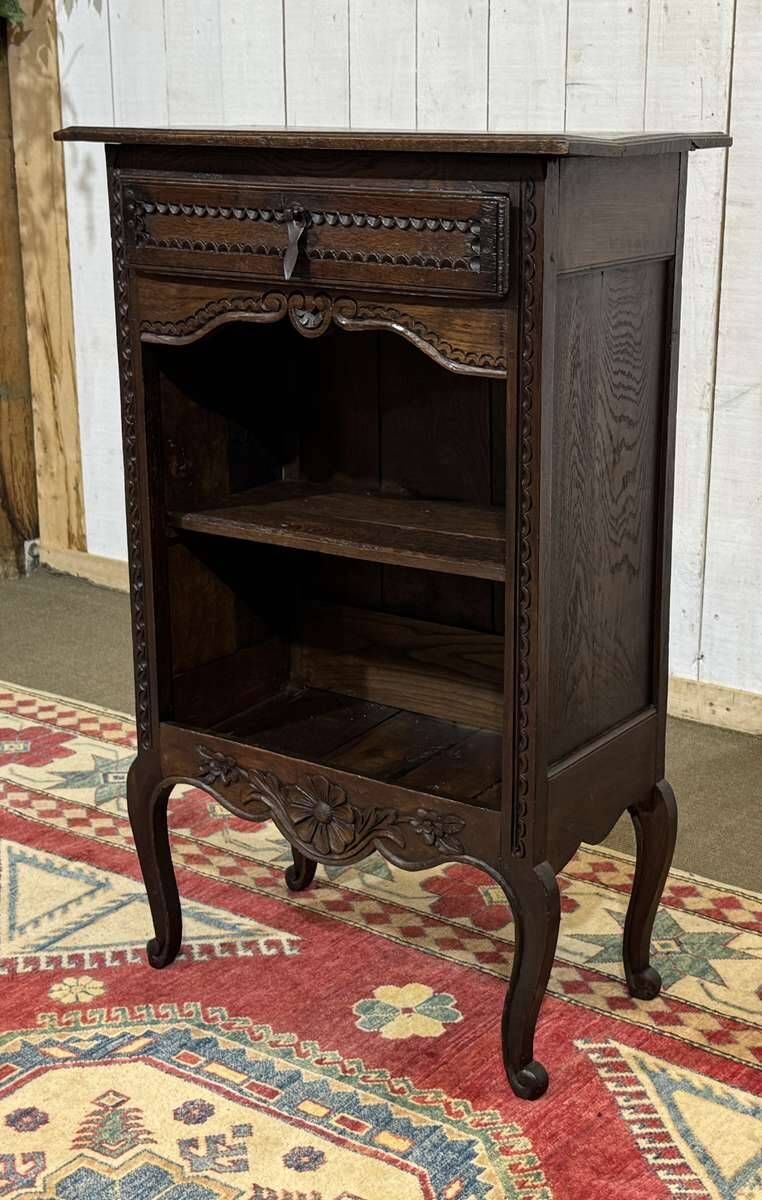 Oak accent furniture bookshelf with a drawer, early 20th century work.