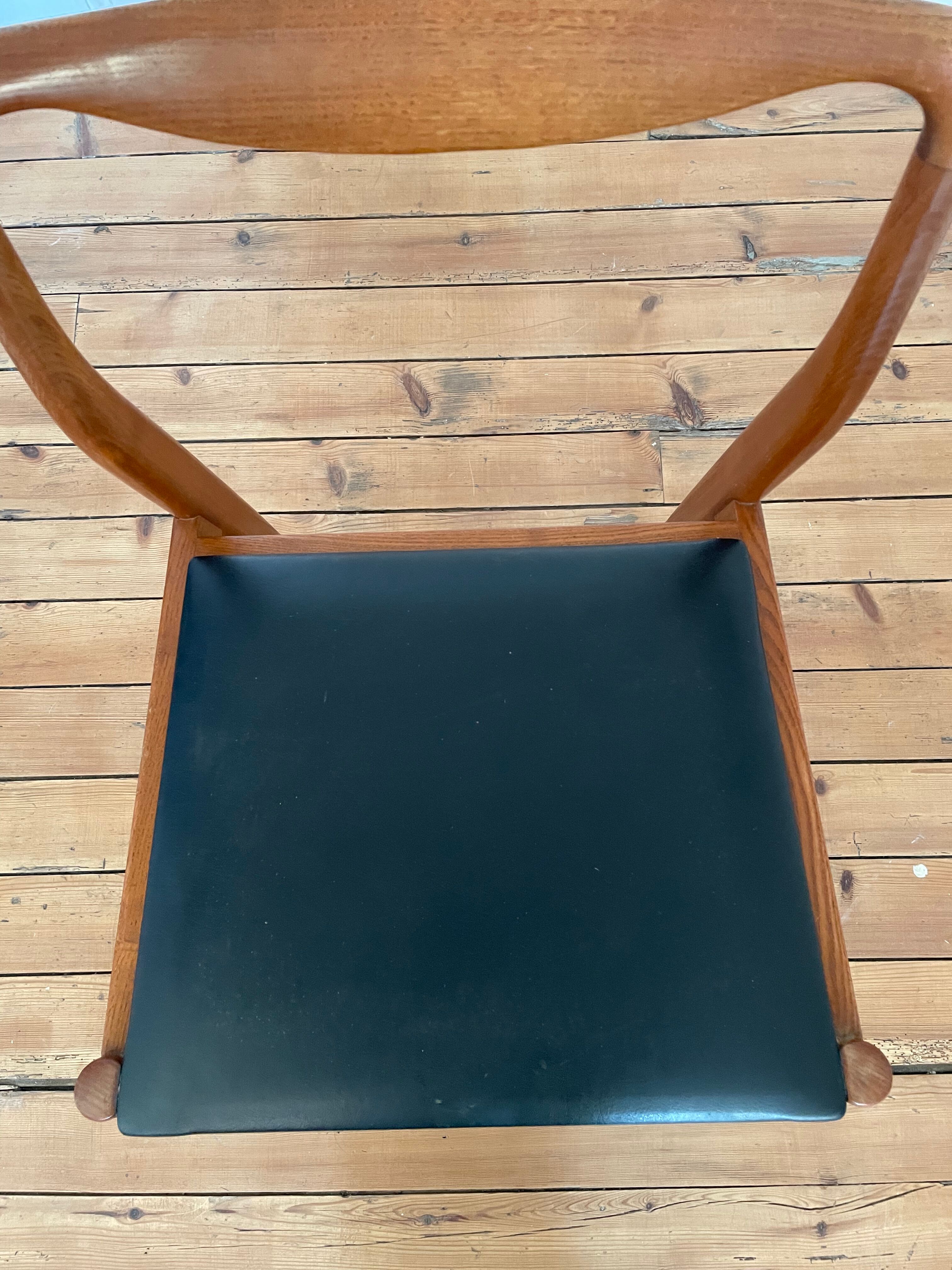 Pair of Scandinavian chairs in teak and skaï, 1965