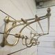 Wall-mounted coat rack with brass hat rack