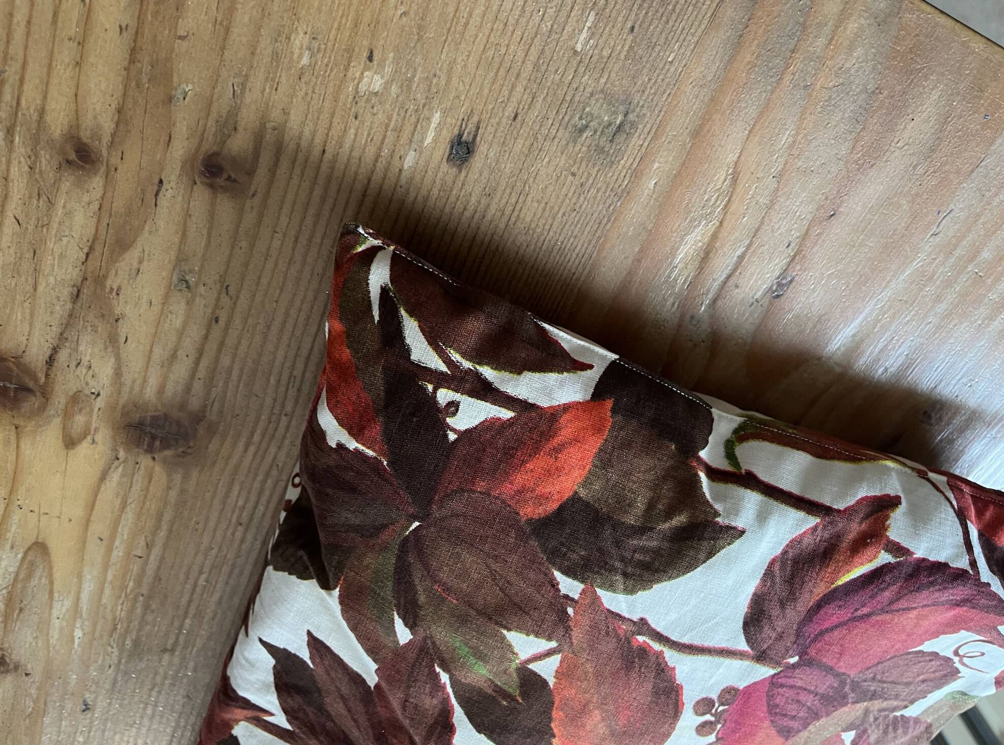 Vintage cushion with virgin vine leaf pattern.