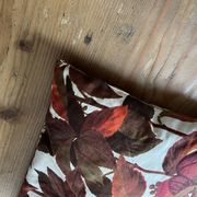 Vintage cushion with virgin vine leaf pattern.