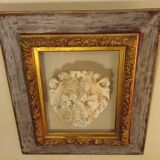 Antique gilded frame with stone lion head ornament on plexiglass