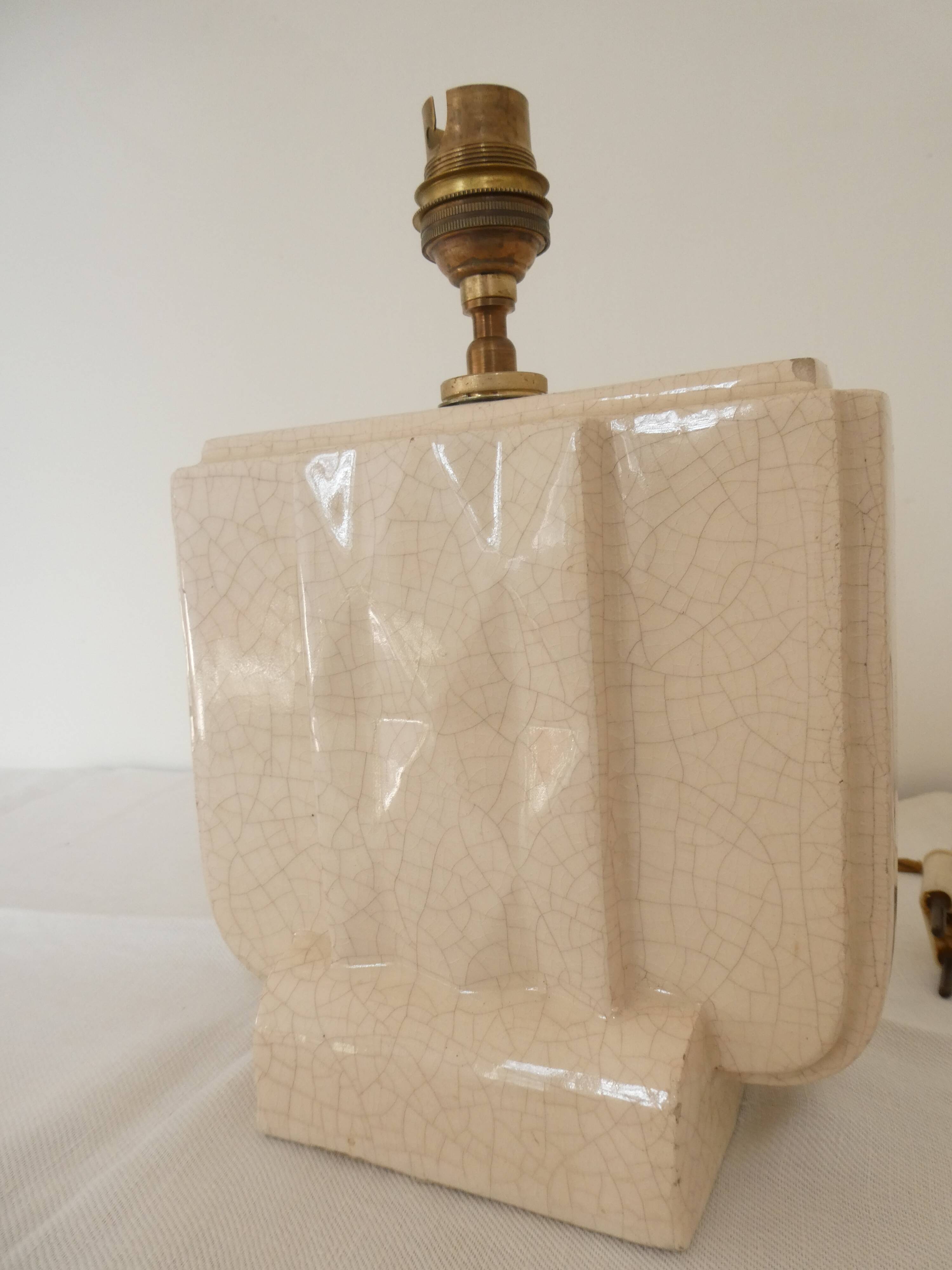 Cream cracked ceramic lamp base in Scandinavian style.