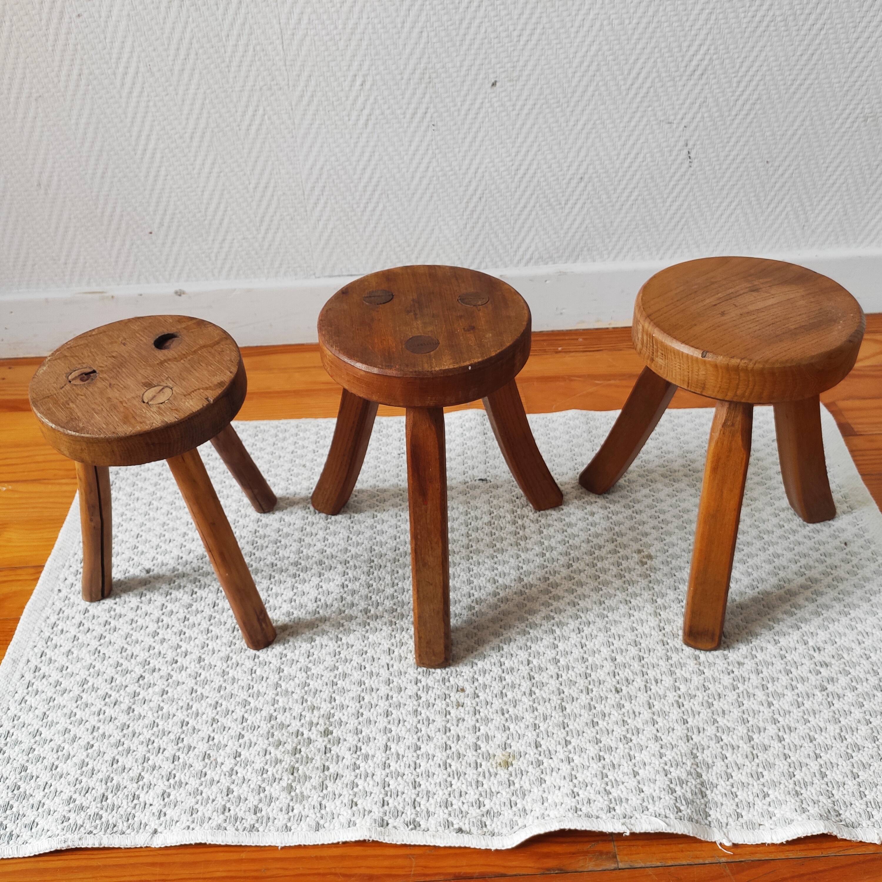 3 wooden tripod stools