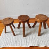 3 wooden tripod stools