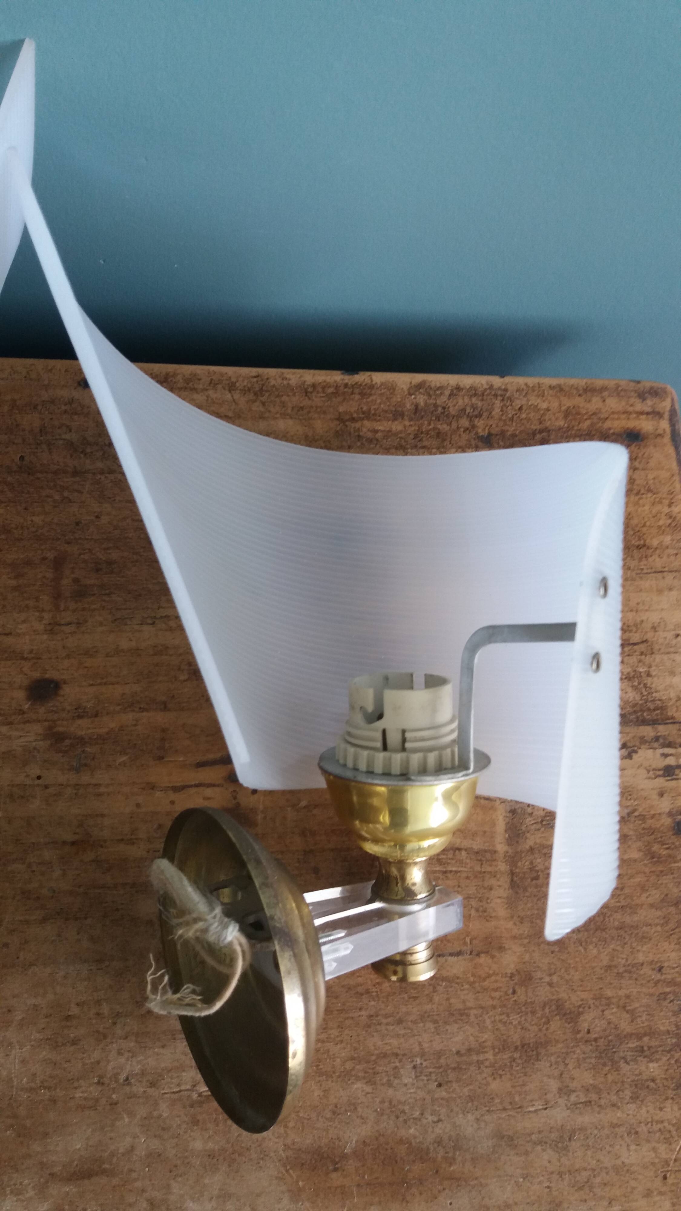 Golden metal appliques and plexiglass perspex in the style of Maison Lunel or Guariche.