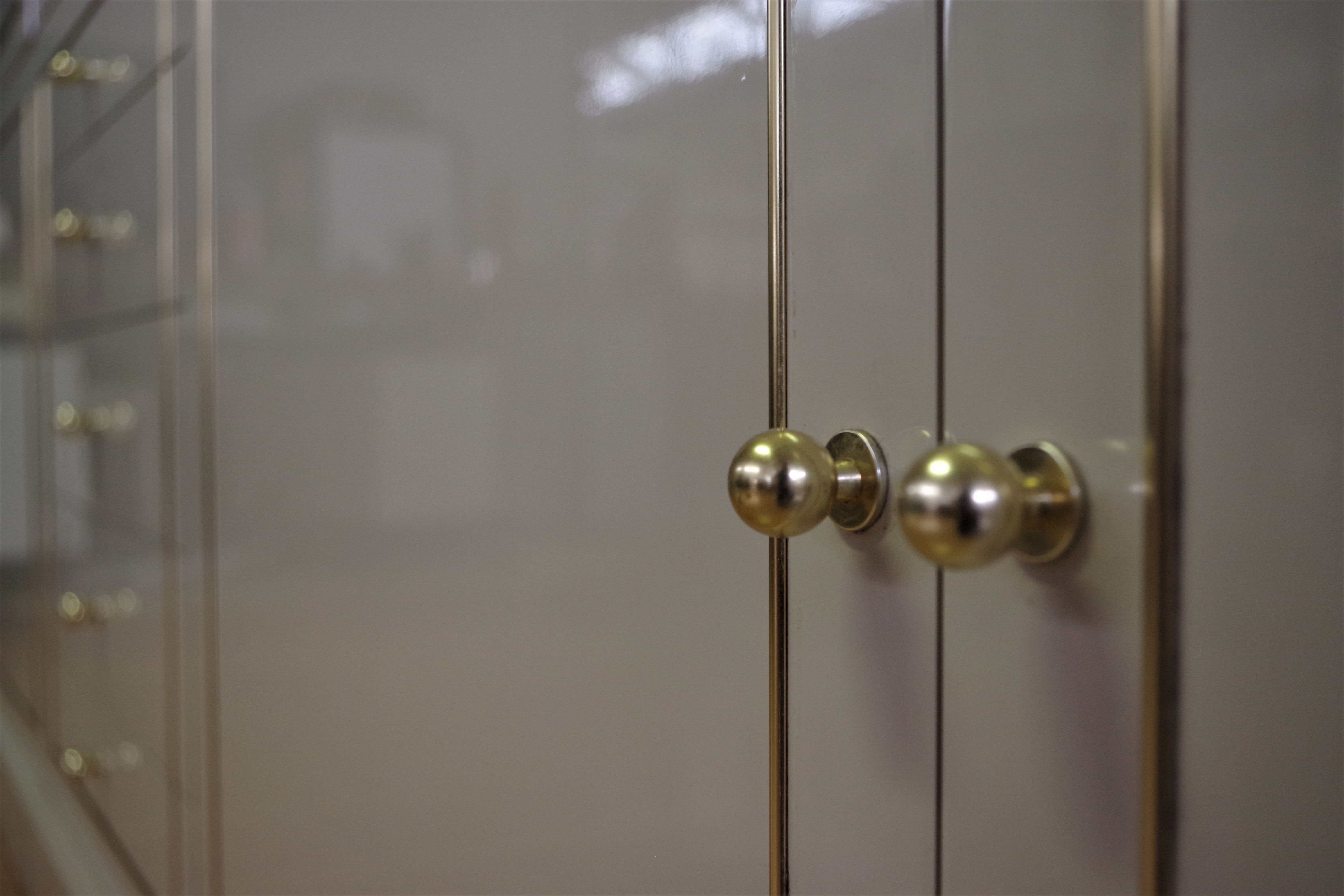 Showcases in lacquered wood, glass and brass  1970s, set of 4