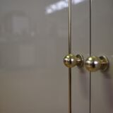 Showcases in lacquered wood, glass and brass  1970s, set of 4
