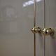 Showcases in lacquered wood, glass and brass  1970s, set of 4