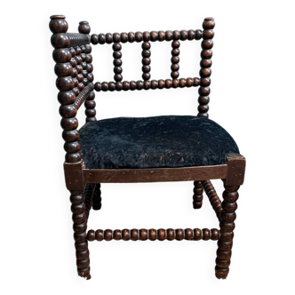 Petit fauteuil d’angle