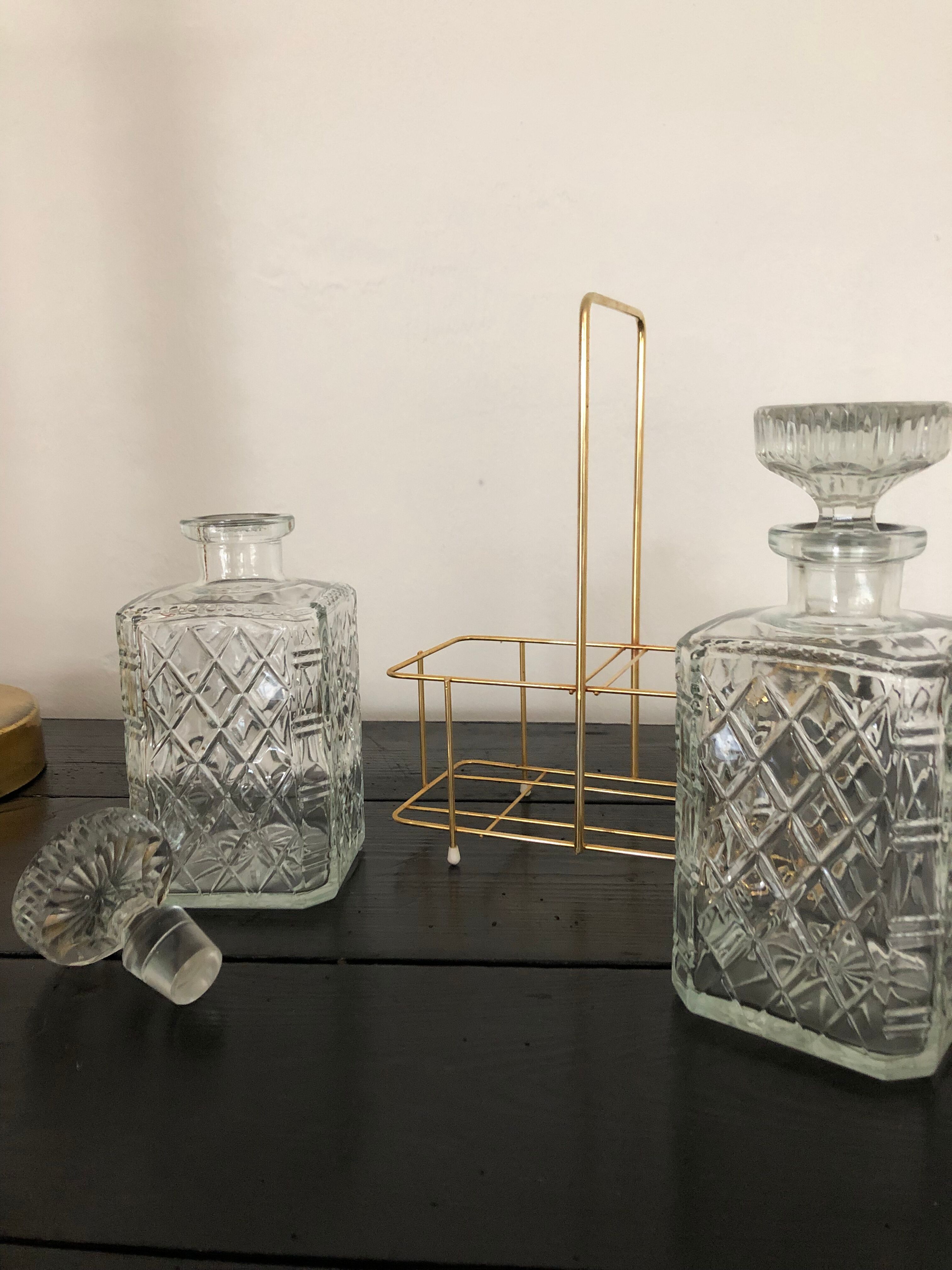 Pair of vintage decanters with brass basket