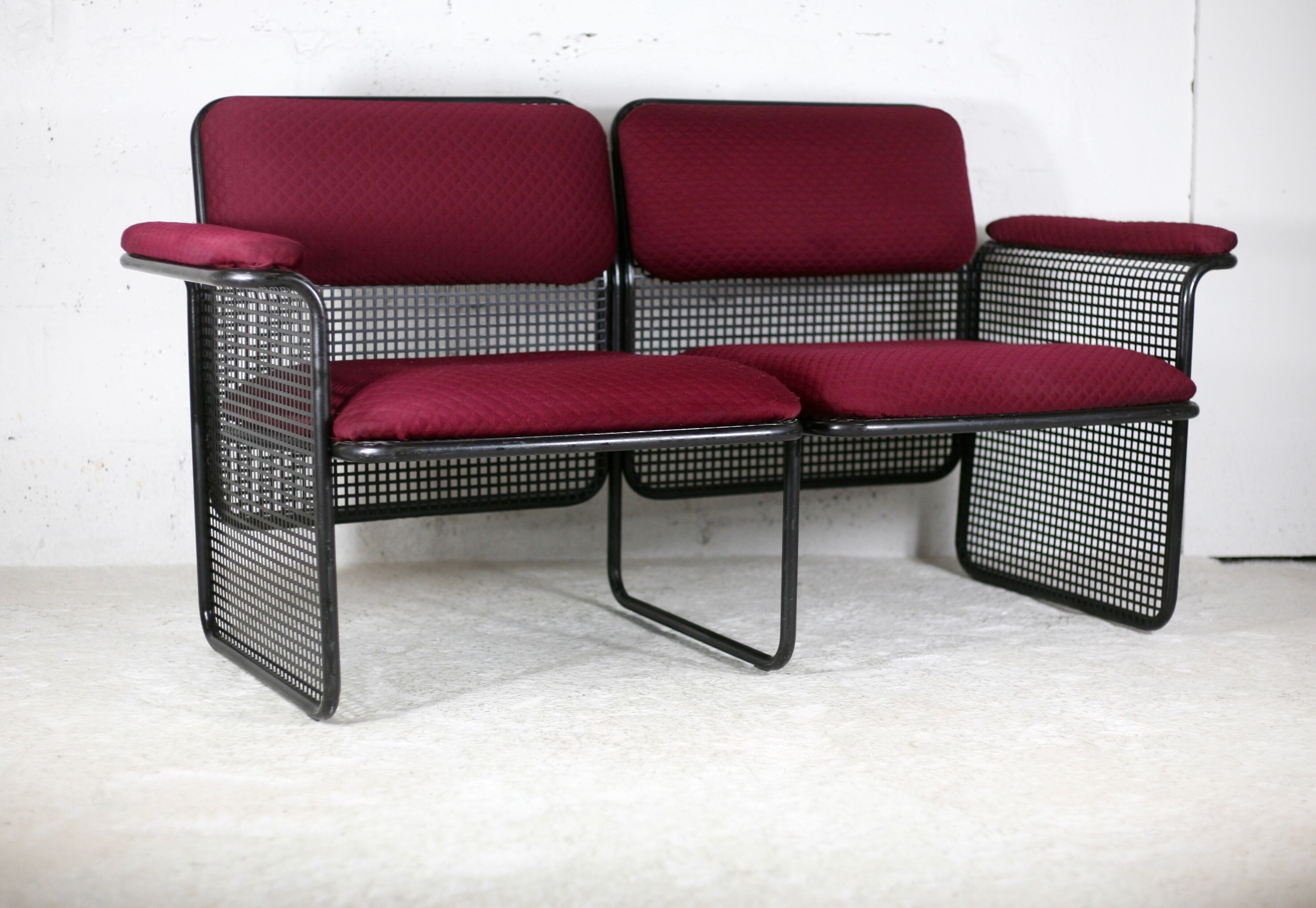 Black honeycomb steel sofa, burgundy fabrics, Italy, circa 1970
