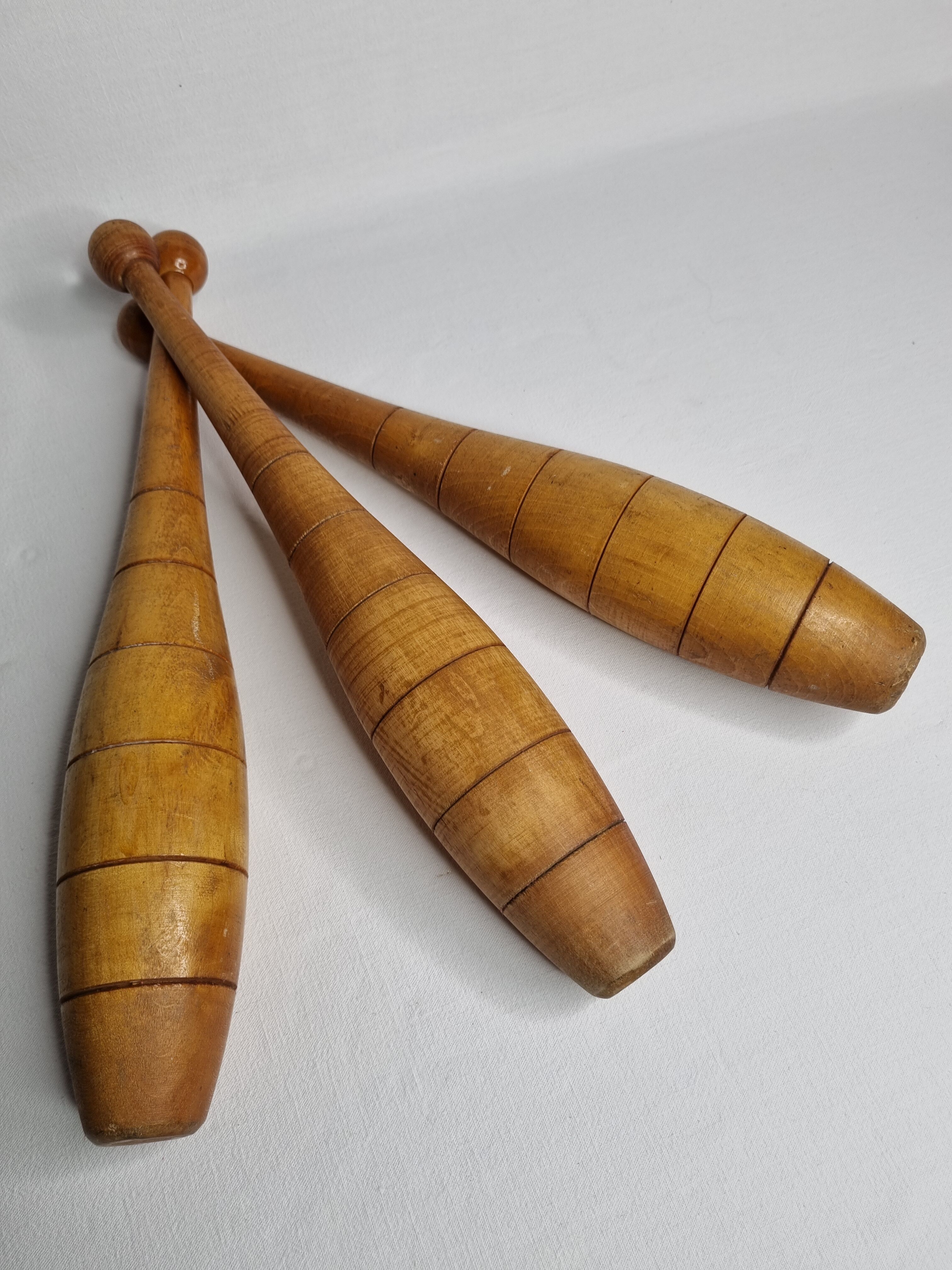 Set of three vintage juggling clubs in turned wood