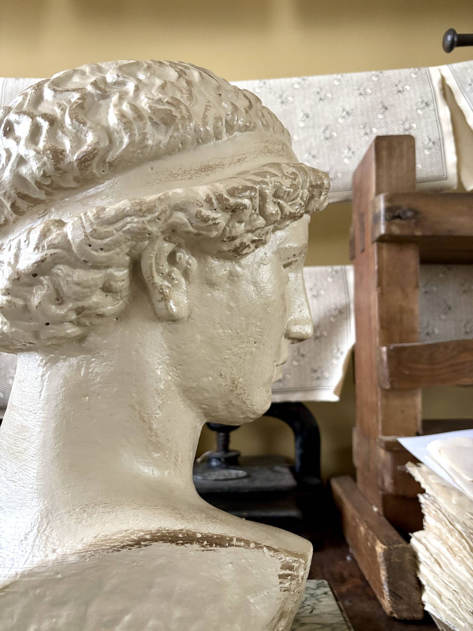 Concrete bust painted in beige - reproduction, detail of "The Dying Slave"