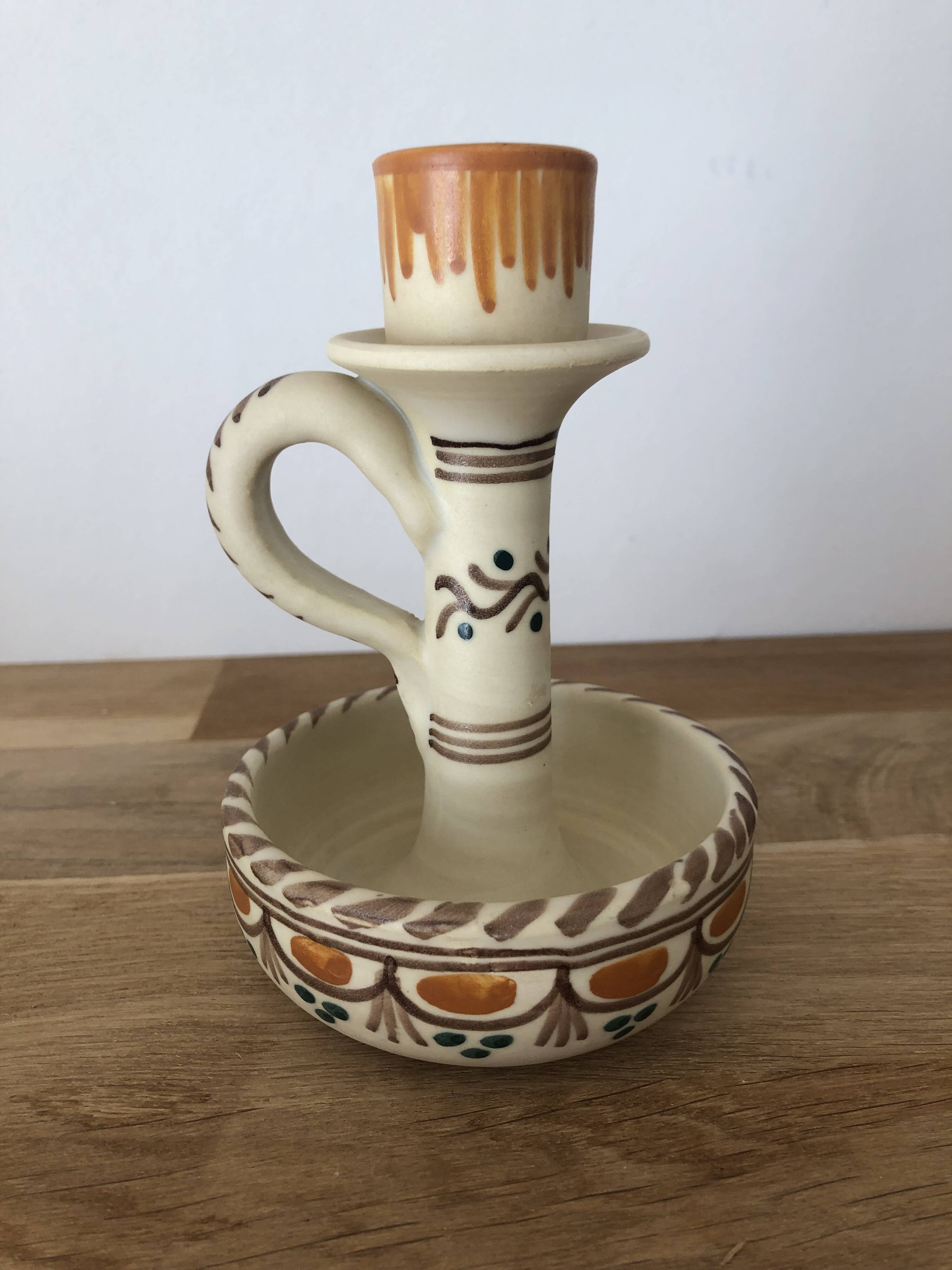 Set of two candlesticks/candle holders in orange and brown tones