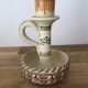 Set of two candlesticks/candle holders in orange and brown tones