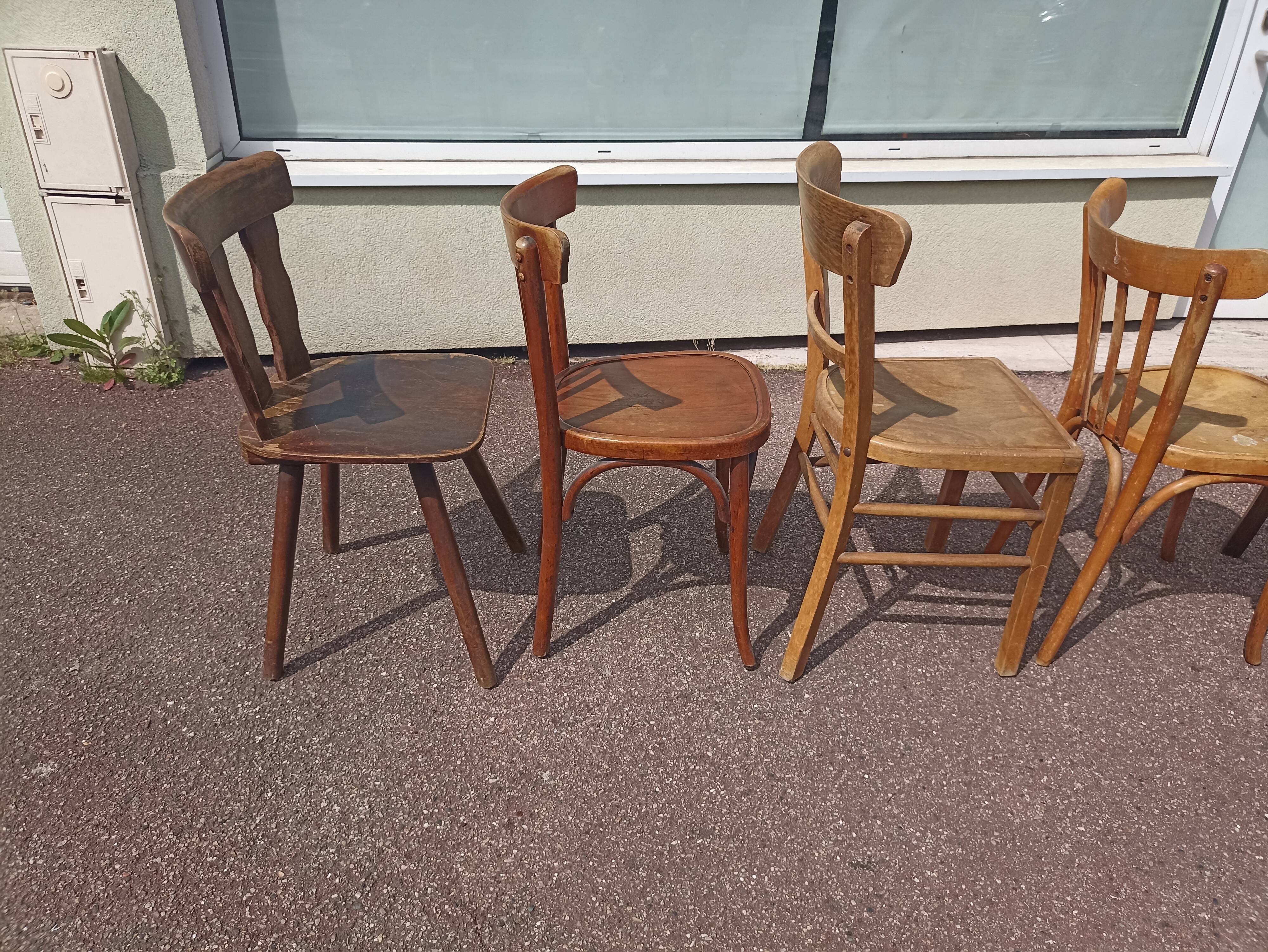 Set of 12 mismatched wooden bistro chairs
