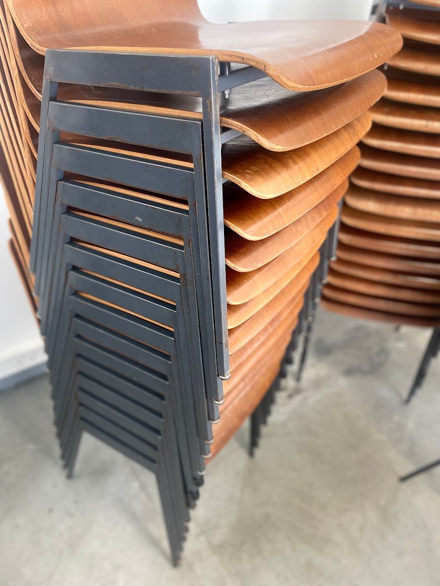 Set of 33 stackable wooden chairs 70s, origin Germany.