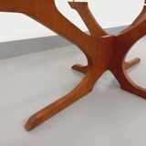 Vintage Hugues Poignant oval coffee table in teak and smoked glass from the 1970s
