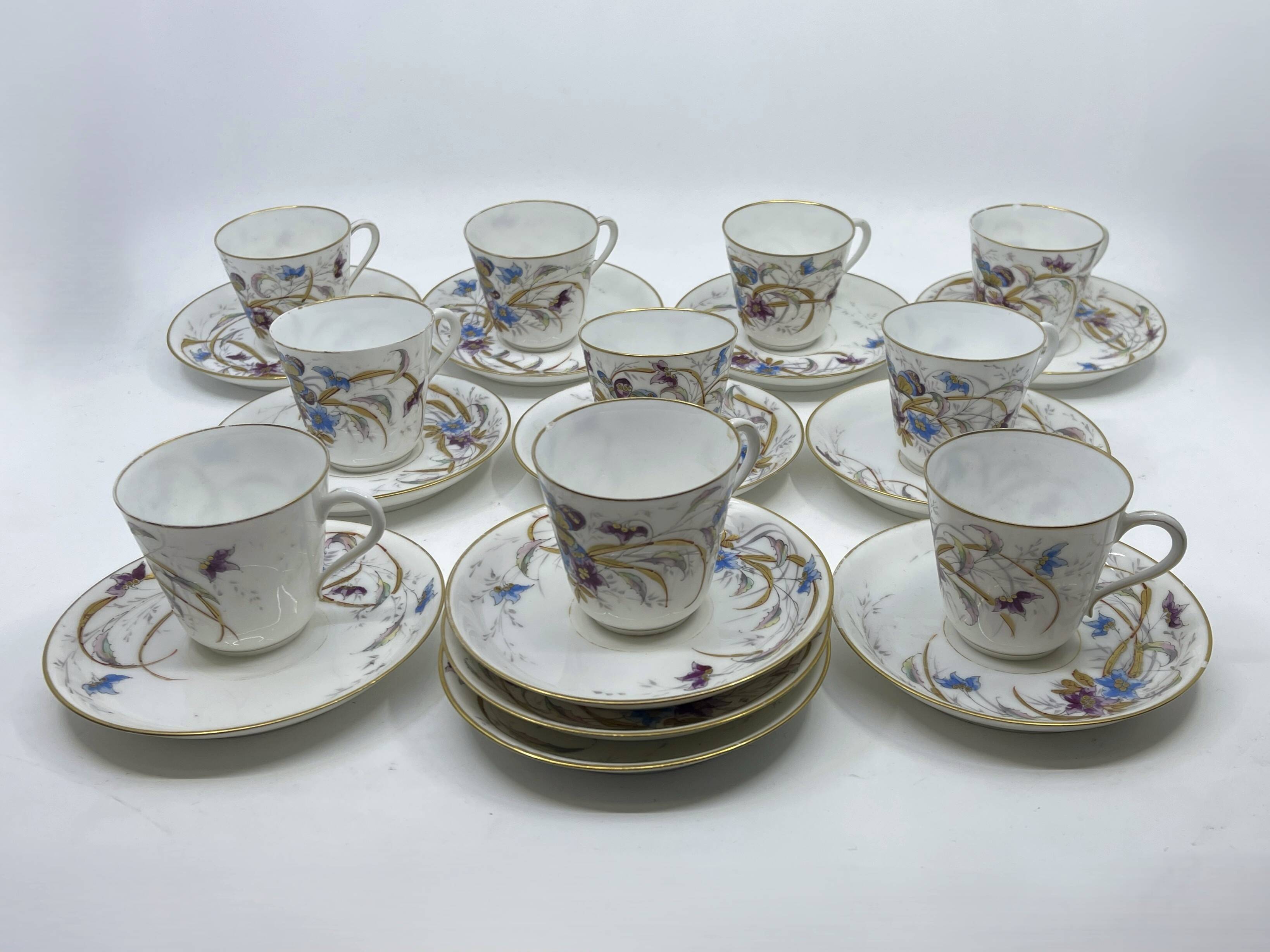 Porcelain tea service with floral and butterfly decorations, 25 pieces.