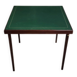 a wooden Bridge game table resting on four thin, straight legs
